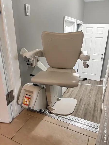 Handicare 1100 stairlift at top landing with easy deboarding